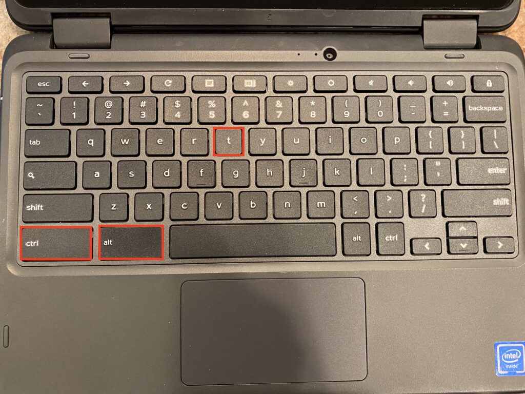 Close-up of a laptop keyboard highlighting the 'ctrl', 'alt', and 't' keys, showcasing a sleek black design.