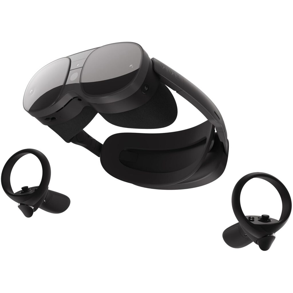 A pair of sleek black virtual reality headsets with two handheld controllers beside them, designed for immersive experiences.