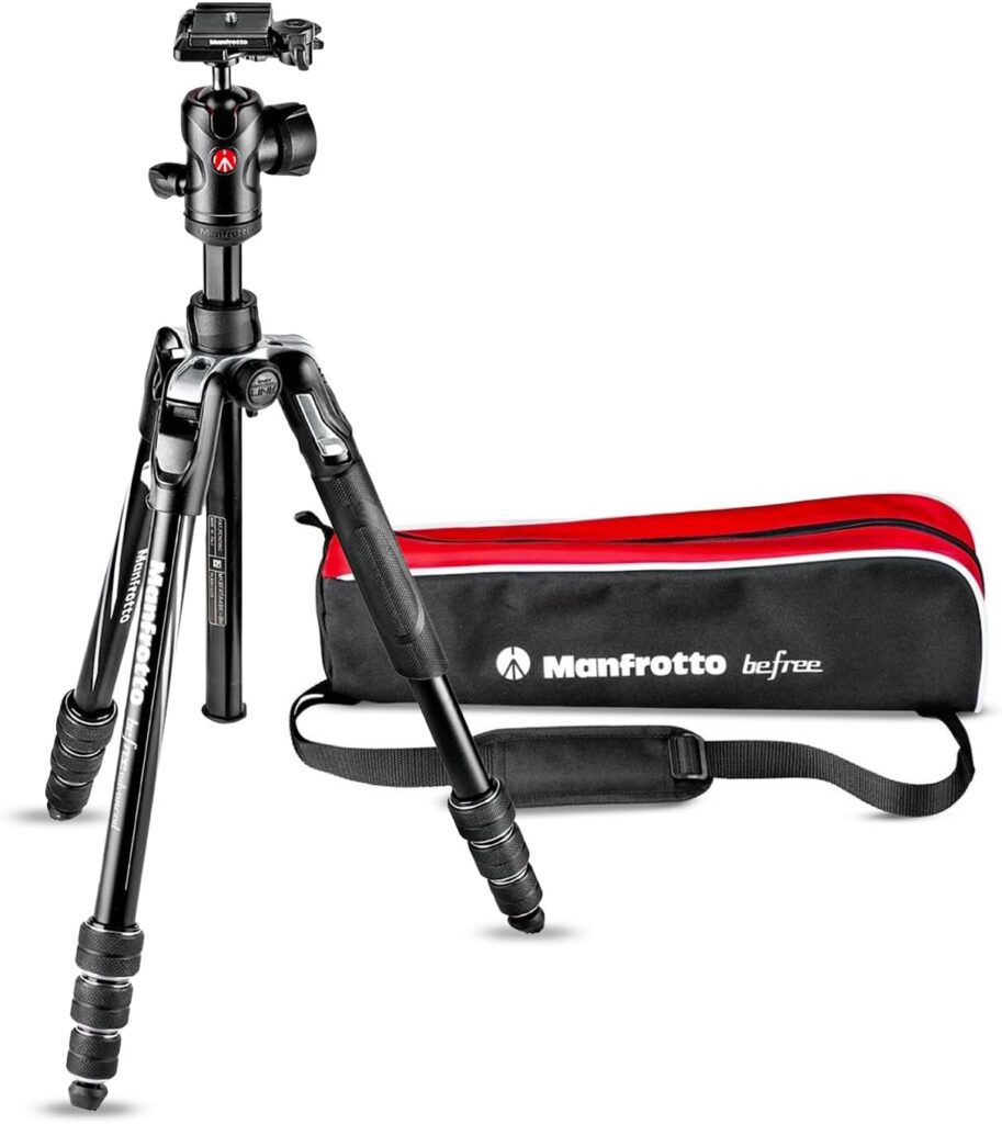 A Manfrotto Befree tripod in black with a ball head, alongside its carrying bag featuring a red and black design.