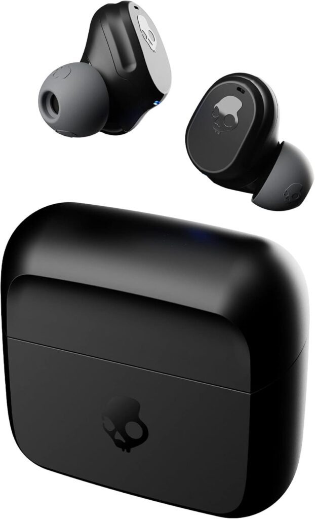 Black wireless earbuds with a charging case, featuring a skull logo; one earbud is partially visible above the case.