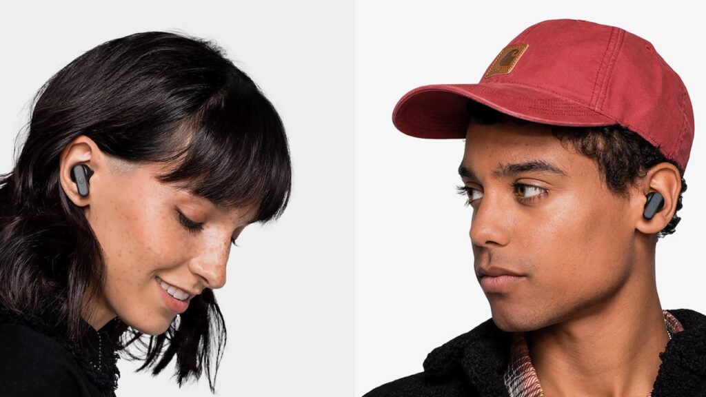 Two individuals wearing wireless earbuds, one with long dark hair and the other in a red cap, set against a plain background.