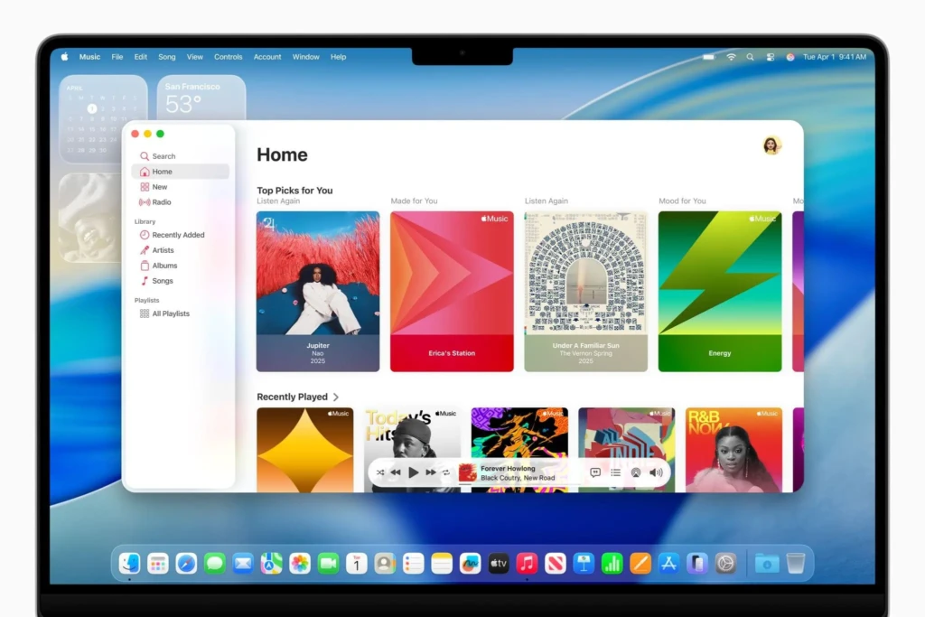 A full-screen view of the Apple Music app on a Mac, displaying the "Home" page. The interface features curated playlists like "Top Picks for You" and "Recently Played," with vibrant album art and a sidebar for navigation. The date "Tue Apr 1" and time "9:41 AM" are visible in the menu bar.