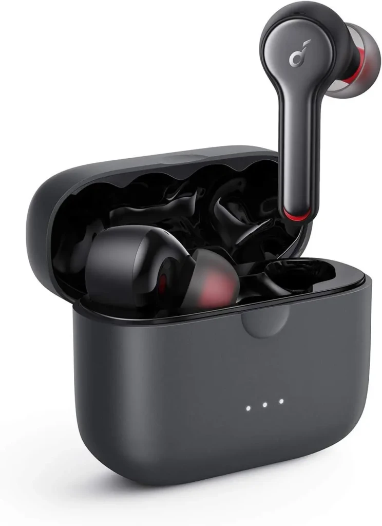 A pair of black wireless earbuds sitting partially out of their charging case, with three charging indicator lights visible.