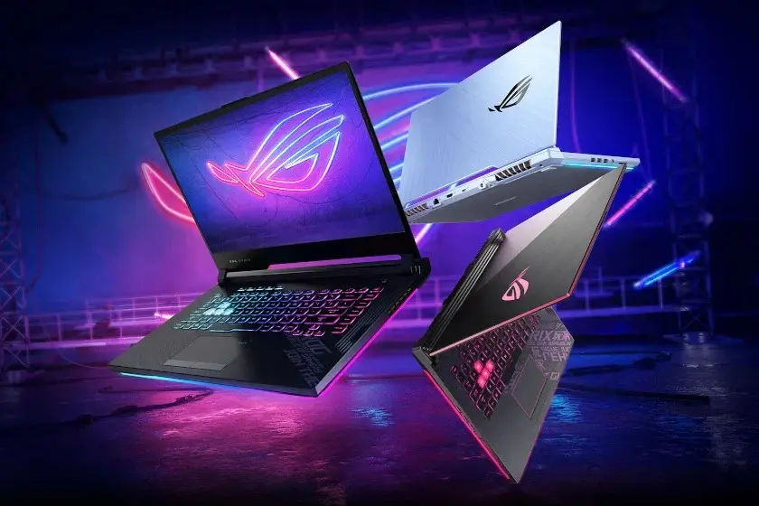 Multiple Asus ROG gaming laptops with RGB keyboards floating against a neon-lit gaming background