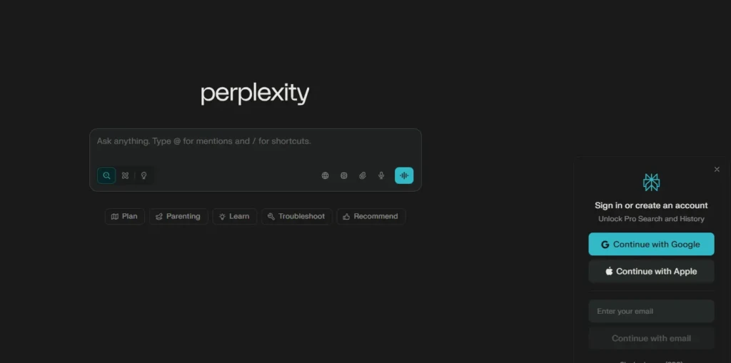 The main search interface for Perplexity AI. It features a prominent search bar with the placeholder text "Ask anything. Type @ for mentions and / for shortcuts." On the right, a sign-in panel offers options to "Continue with Google," "Continue with Apple," or use email to unlock Pro Search and History.