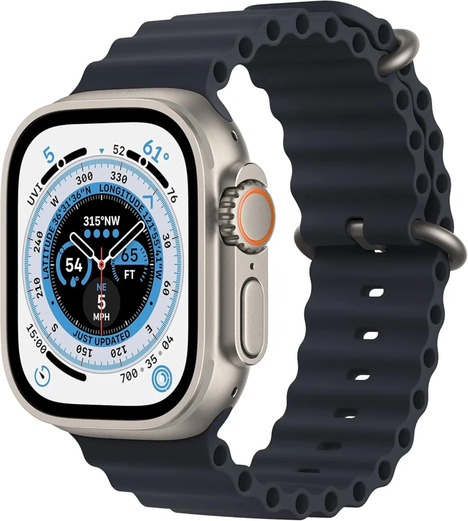 A silver Apple Watch Ultra with a dark blue Ocean Band, featuring a detailed compass watch face showing latitude, longitude, direction (315° NW), altitude (65 ft), wind speed (5 MPH), and UVI, highlighting its advanced outdoor navigation and rugged build for extreme sports and exploration.