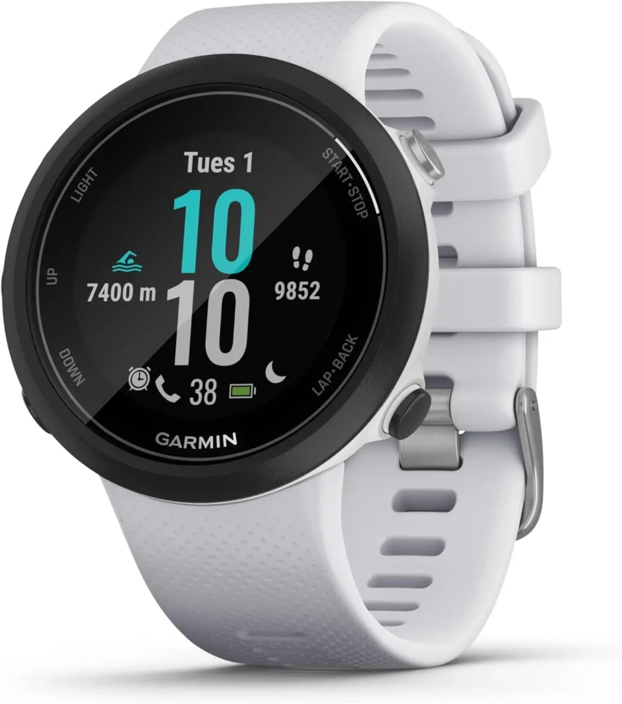 A white Garmin Swim 2 smartwatch with a silicone strap, showing a swim-focused workout screen with metrics like 7400m distance, 9852 steps, and 38% battery, emphasizing its multi-sport functionality and intuitive interface for athletes.