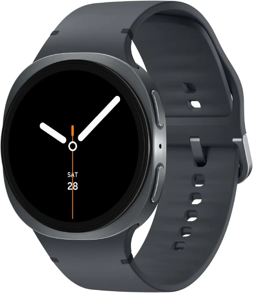 A sleek Samsung Galaxy Watch with a minimalist analog-style face showing time, day (SAT), and date (28), encased in brushed metal with a dark gray silicone strap, emphasizing its clean, modern aesthetic and everyday wearability for casual and professional use.