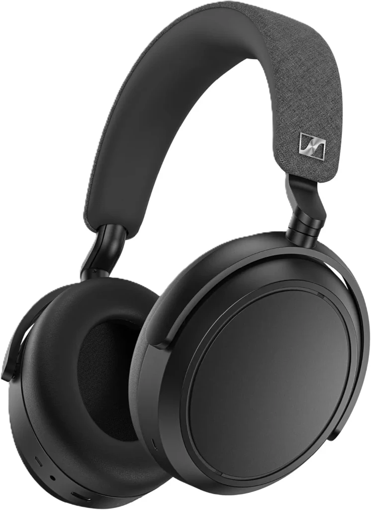 A black Sennheiser Momentum 4 Wireless over-ear headphone with a textured gray headband and silver Sennheiser logo, shown against a white background, emphasizing its sophisticated design, plush earpads, and high-fidelity audio engineering.
