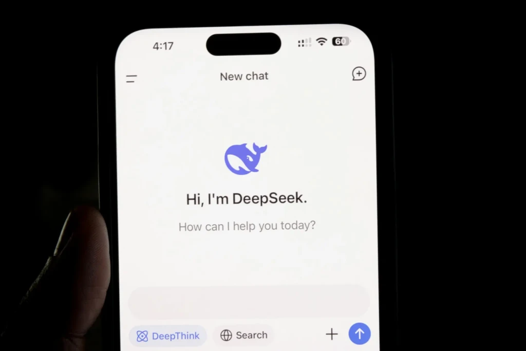 A close-up of a smartphone displaying the DeepSeek AI chat interface with its blue whale logo and greeting: “Hi, I’m DeepSeek. How can I help you today?” showing the app’s conversational design and user-friendly onboarding experience.
