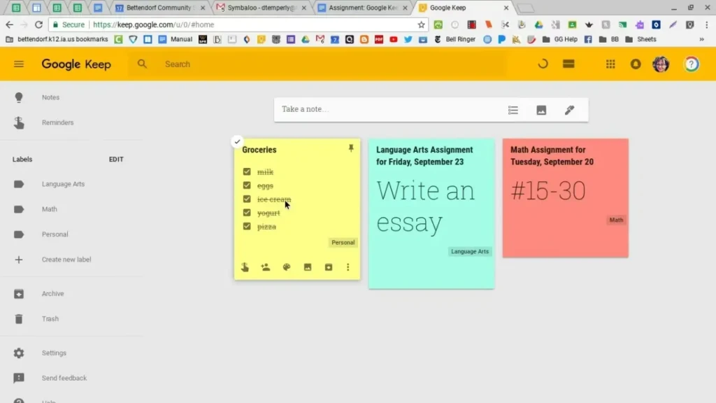 A screenshot of the Google Keep web interface showing a clean, organized dashboard with three colorful notes: a yellow “Groceries” checklist (with items like milk, eggs, ice cream), a teal “Language Arts Assignment” note prompting to “Write an essay,” and a pink “Math Assignment” reminder for problems #15–30. The left sidebar displays labels like “Language Arts,” “Math,” and “Personal”