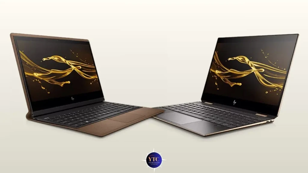 Two HP Spectre laptops, one in bronze and one in silver, shown side by side against a light background. Both screens display a dynamic golden liquid splash wallpaper, highlighting their premium design and vibrant displays