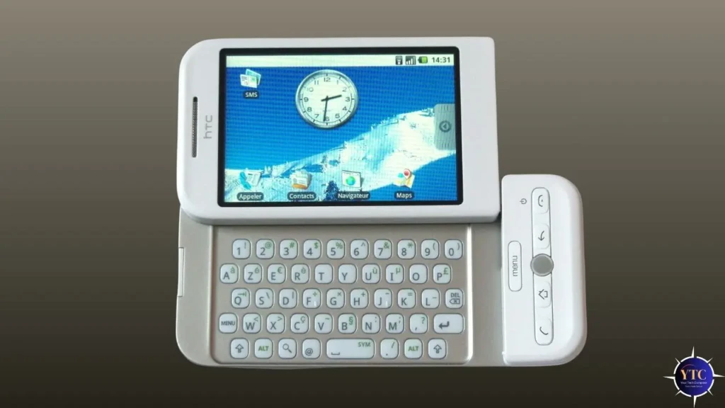 A white HTC Dream smartphone (the first Android phone) shown open, revealing its slide-out QWERTY keyboard and touchscreen displaying the Android 1.0 home screen with apps like SMS, Contacts, and Maps, highlighting its iconic design and pioneering role in Android history.