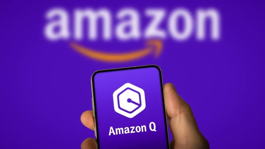 A hand holding a smartphone displaying the Amazon Q logo (a white hexagon with a stylized “Q”) and text “Amazon Q,” against a blurred purple background with the larger “amazon” logo and smile arrow, highlighting the conversational AI assistant for enterprise productivity.