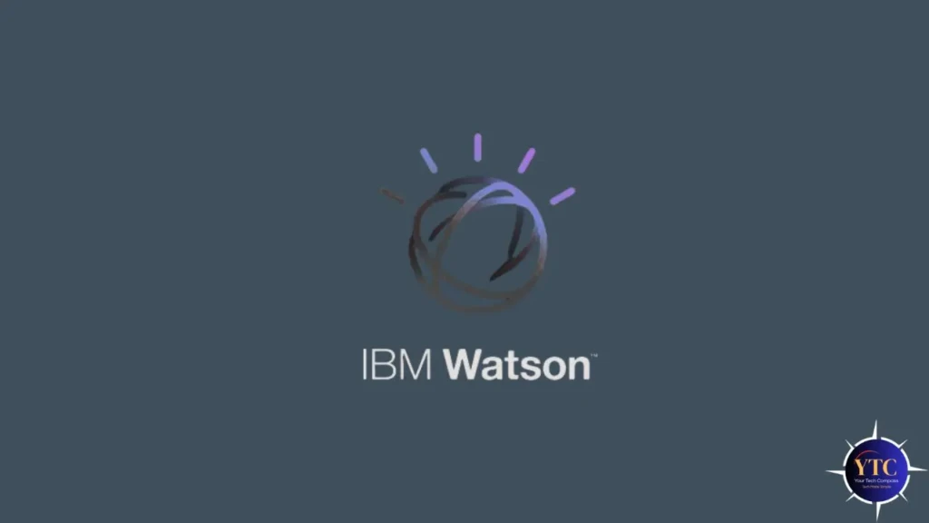 The IBM Watson logo, a stylized sphere with radiating light rays in purple and blue, centered above the text “IBM Watson” on a dark gray background, representing the brand’s identity as an AI and cognitive computing platform.
