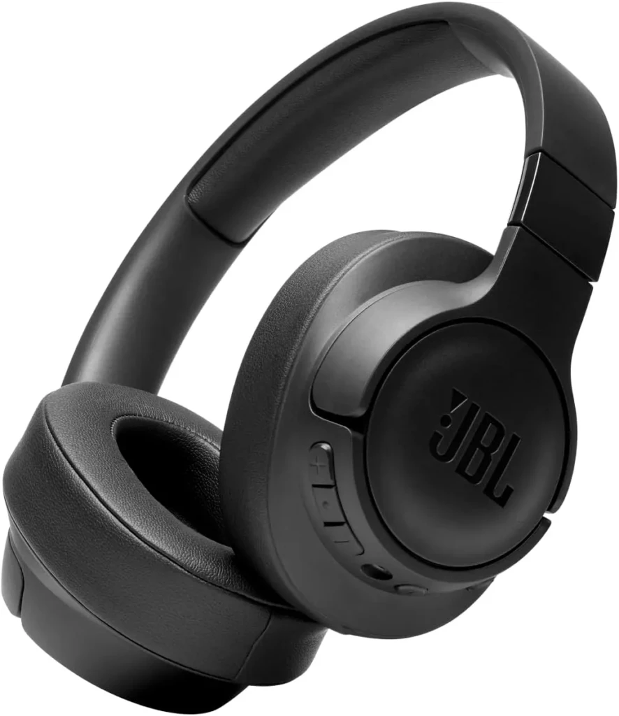 A matte black JBL over-ear headphone with textured ear cushions, integrated control buttons on the earcup, and the “JBL” logo debossed on the side, displayed at an angle to highlight its ergonomic form and minimalist styling for casual or travel use.