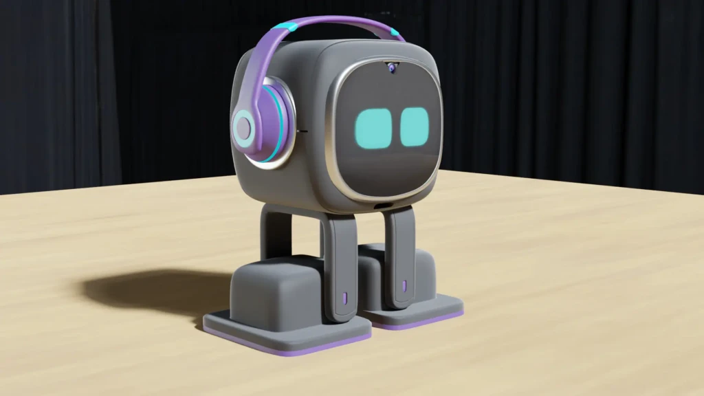 A 3D-rendered EMO robot in gray with purple-and-cyan headphones, standing on its dual-leg base atop a light wood table against a dark curtain backdrop, emphasizing its sleek, expressive design and studio-product presentation.