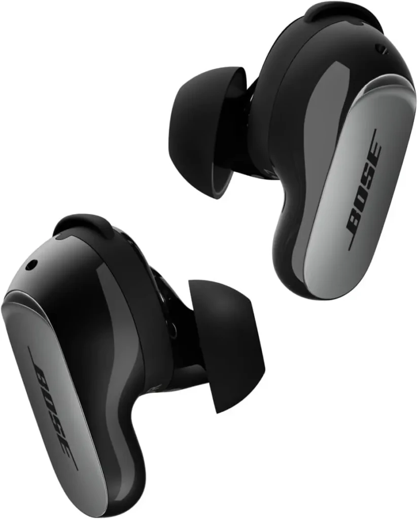 Sleek, black Bose wireless earbuds with a glossy finish and ergonomic design. They feature silicone ear tips and subtle branding, conveying modern elegance.