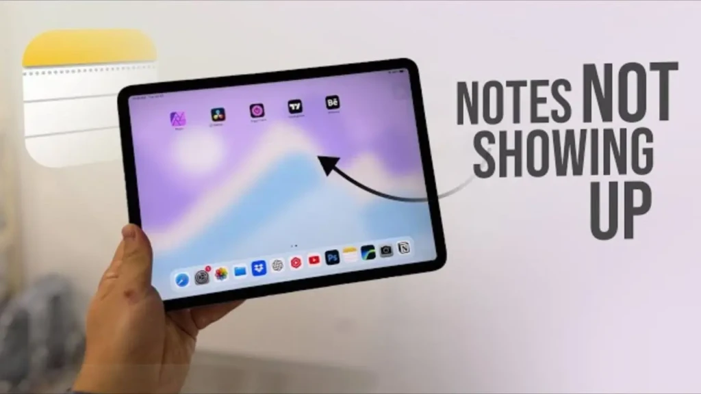 A hand holding an iPad with the home screen visible, alongside bold text reading “NOTES NOT SHOWING UP” and a curved arrow pointing toward the Notes app icon, illustrating a troubleshooting scenario for users experiencing missing or inaccessible Notes on iOS/iPadOS.