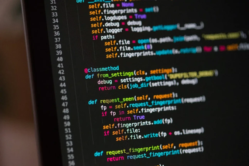 A close-up of a computer screen displaying Python code with syntax highlighting, including methods like from_settings, request_seen, and request_fingerprint, against a dark theme, illustrating backend development or web scraping logic, likely related to AI tool integration or data processing.