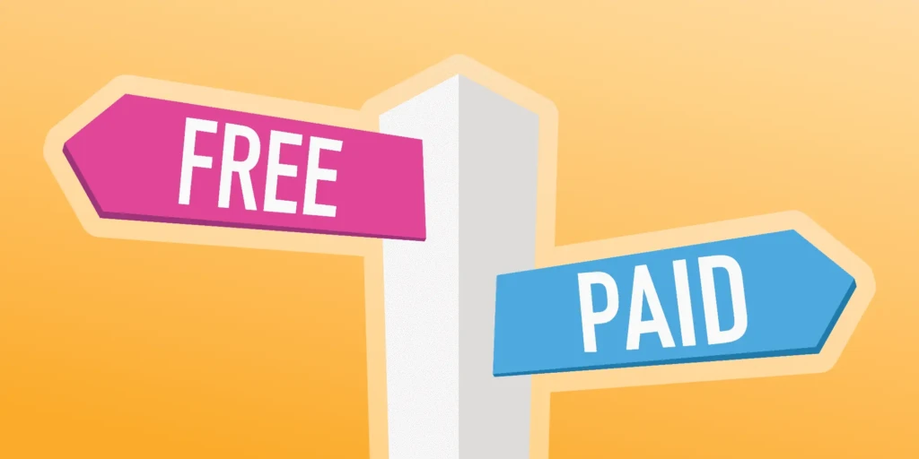 A stylized signpost with two directional arrows: a pink arrow labeled “FREE” pointing left and a blue arrow labeled “PAID” pointing right, against a warm orange background, representing the choice between free and paid educational technology resources.