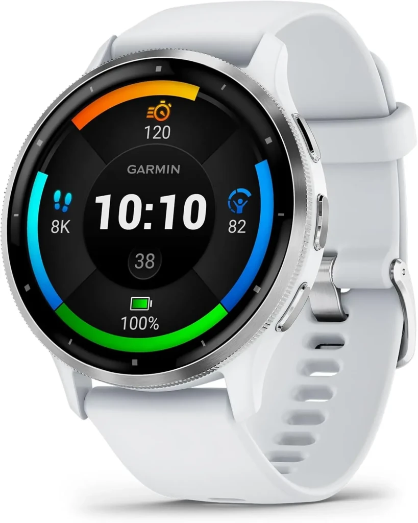 A white Garmin smartwatch with a silver bezel and silicone strap, showing a colorful multi-ring dashboard with time (10:10), steps (8K), heart rate (82), battery (100%), and training status (120), illustrating advanced health and fitness monitoring in a clean, premium design.