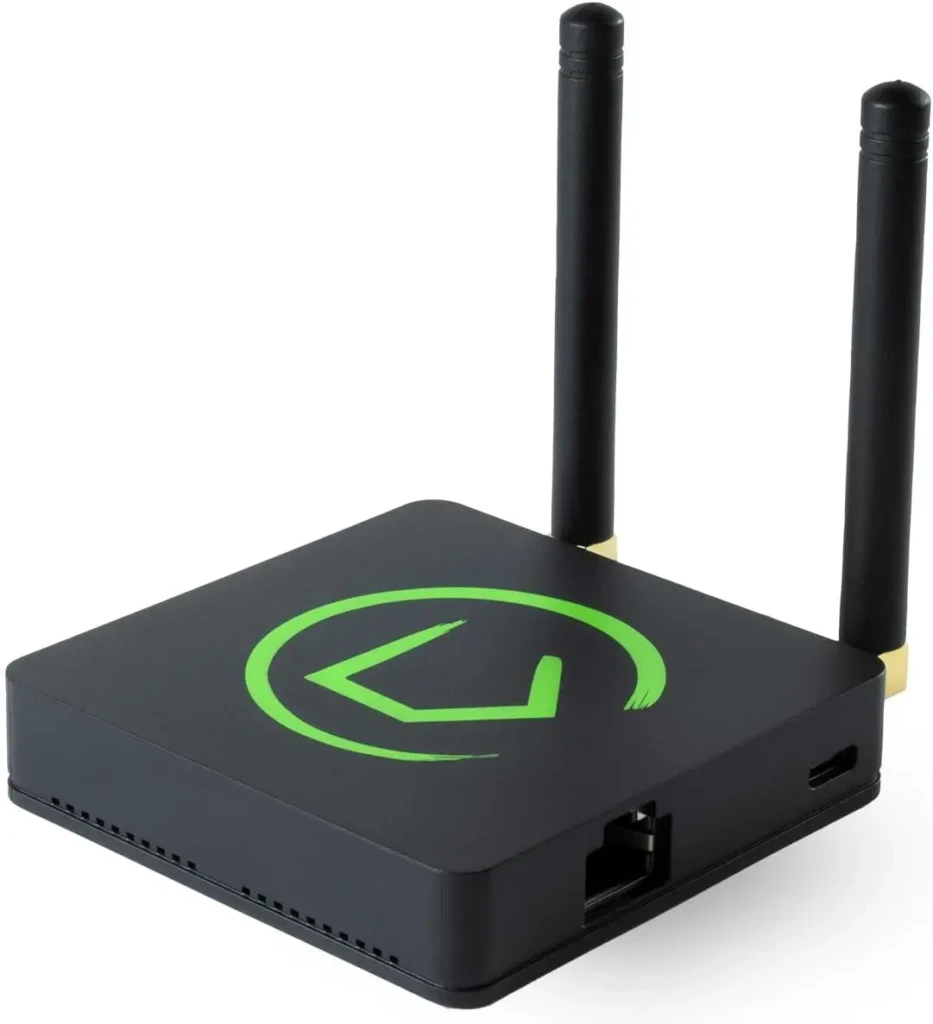 A compact black wireless streaming device with two external antennas, a green circular logo on top, and visible ports (Ethernet, USB), designed for media or smart home connectivity, highlighting its minimalist industrial design and networking capabilities.