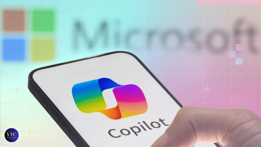 A hand holding a smartphone displaying the Microsoft Copilot logo (multicolor overlapping squares) and the word “Copilot,” with a faint Microsoft logo and colorful grid pattern in the background, illustrating Microsoft’s AI assistant integrated into mobile experiences.