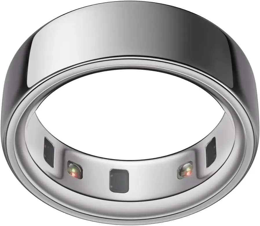 A polished silver smart ring shown from above, featuring three embedded optical sensors with subtle LED indicators and a smooth, seamless metallic band, emphasizing minimalist design and precision engineering for health tracking.