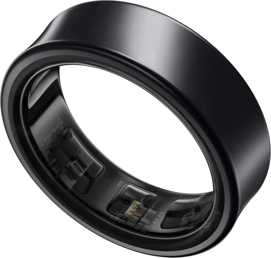 A matte black smart ring with a cutaway interior view displaying integrated circuitry, battery, and sensor modules, illustrating the compact electronics housed within its sleek, ergonomic form factor.