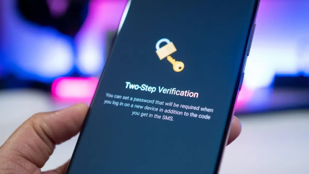 Smartphone screen showing a two-step verification setup with a padlock icon. A blurred, colorful background adds a sense of modernity and security.