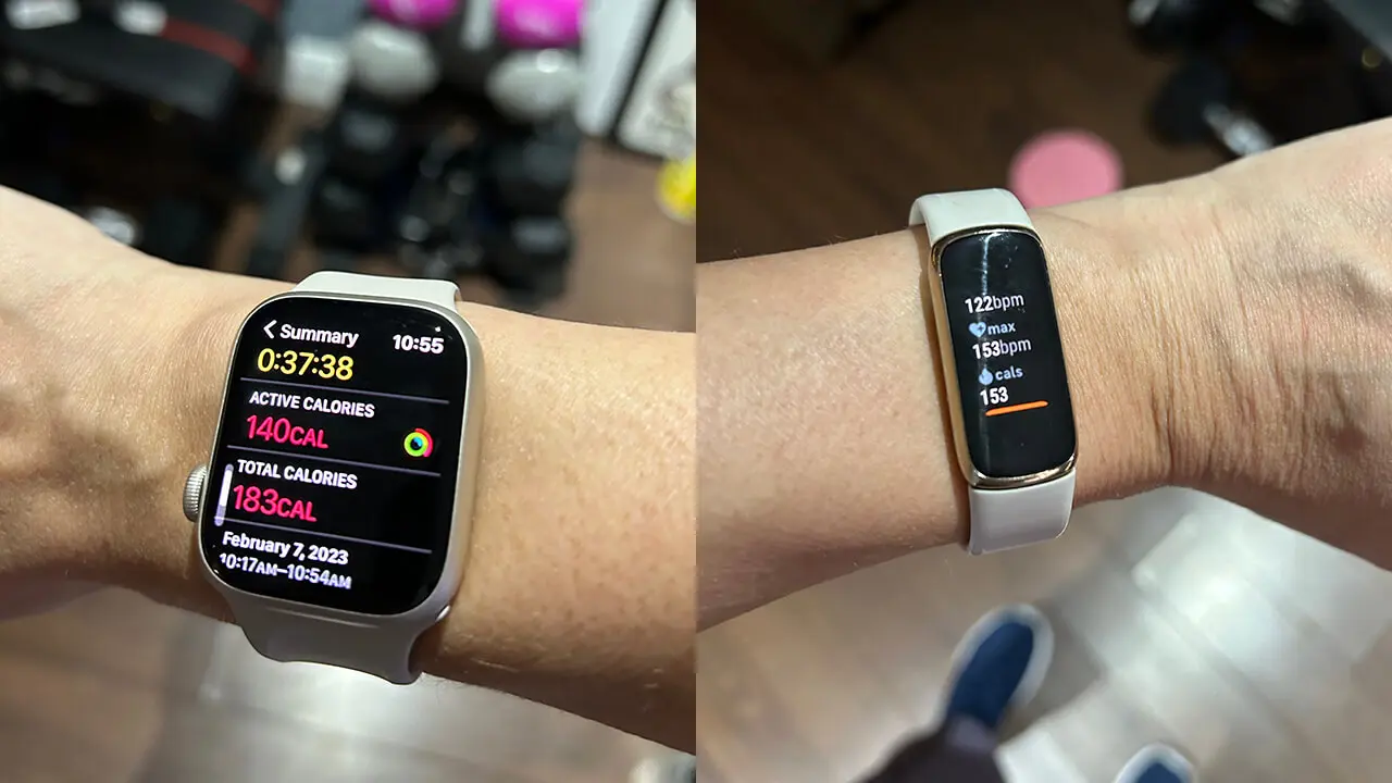 Two smartwatches on different wrists display fitness stats. The watch on the left shows calories burned, and the watch on the right shows heart rate details.