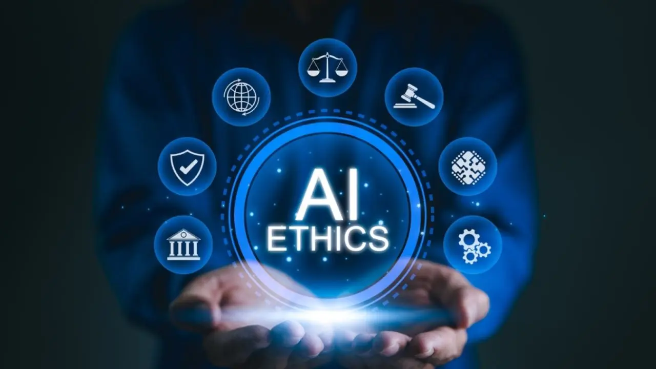 Hands holding a glowing "AI Ethics" text surrounded by digital icons representing law, balance, security, and technology on a blue background.