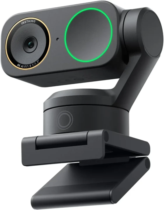 A sleek black webcam with a gold-ringed lens and a green-lit circle on the front, mounted on an adjustable black stand for easy positioning.