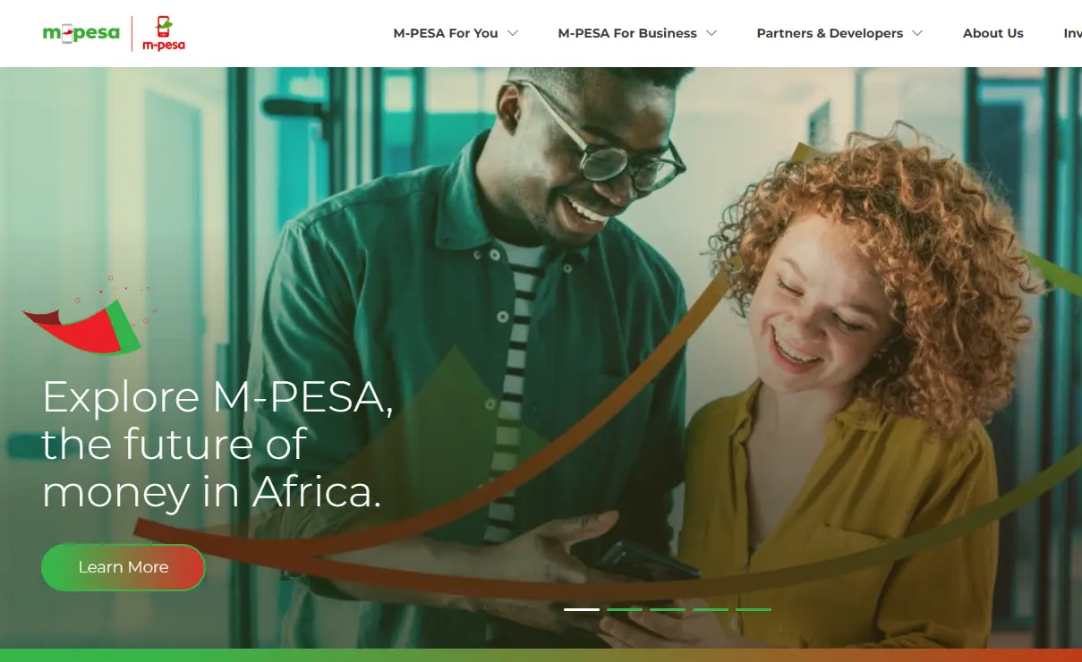 Two people smiling and looking at a phone, with text reading, "Explore M-PESA, the future of money in Africa." A "Learn More" button is visible.