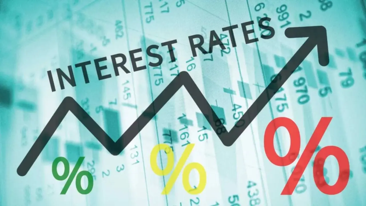 Graph depicting rising interest rates with a bold upward arrow. The backdrop features financial data and prominent percentage symbols, conveying economic growth.