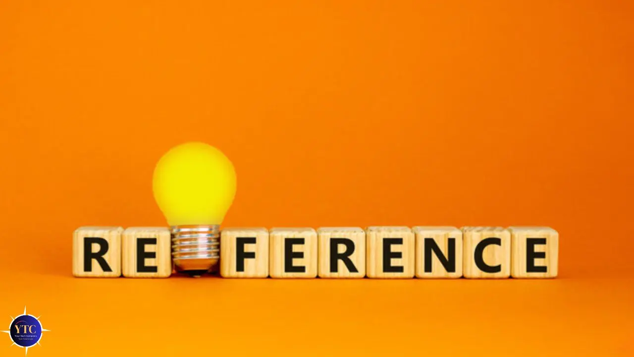 Wooden blocks spell "REFERENCE" with a glowing lightbulb as the second "E." Set against an orange background, conveying ideas and creativity.