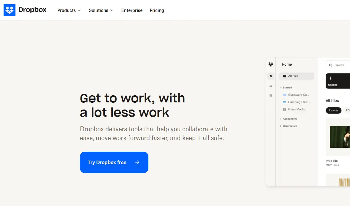 Dropbox homepage featuring the slogan "Get to work, with a lot less work" and a preview of the Dropbox file management interface.