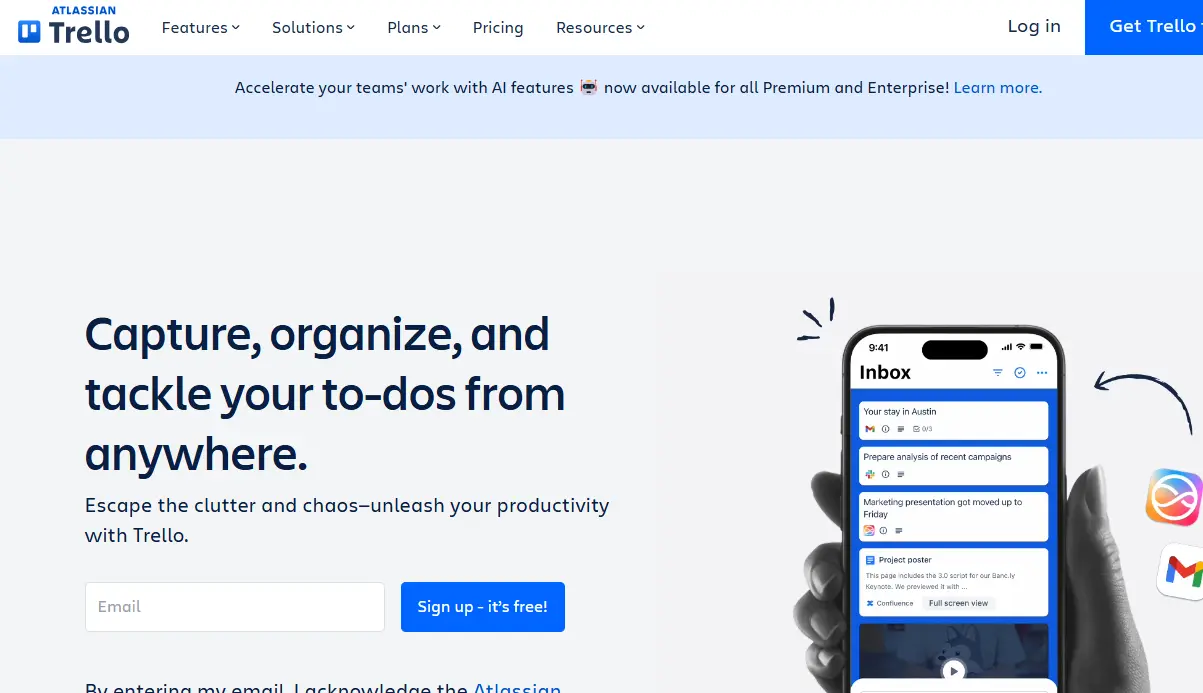 Trello website homepage showing "Capture, organize, and tackle your to-dos from anywhere" text and a smartphone displaying an inbox.
