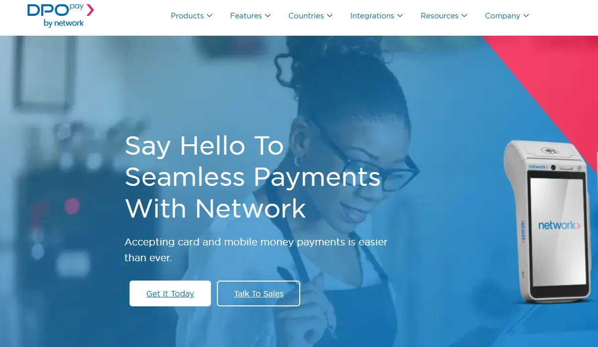 A woman wearing glasses smiles while a credit card reader displays the "network>" logo, promoting seamless payments.